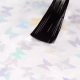 Applying Dancing Butterflies UV gel nail polish on a colorful butterfly design, ideal for spring manicures.