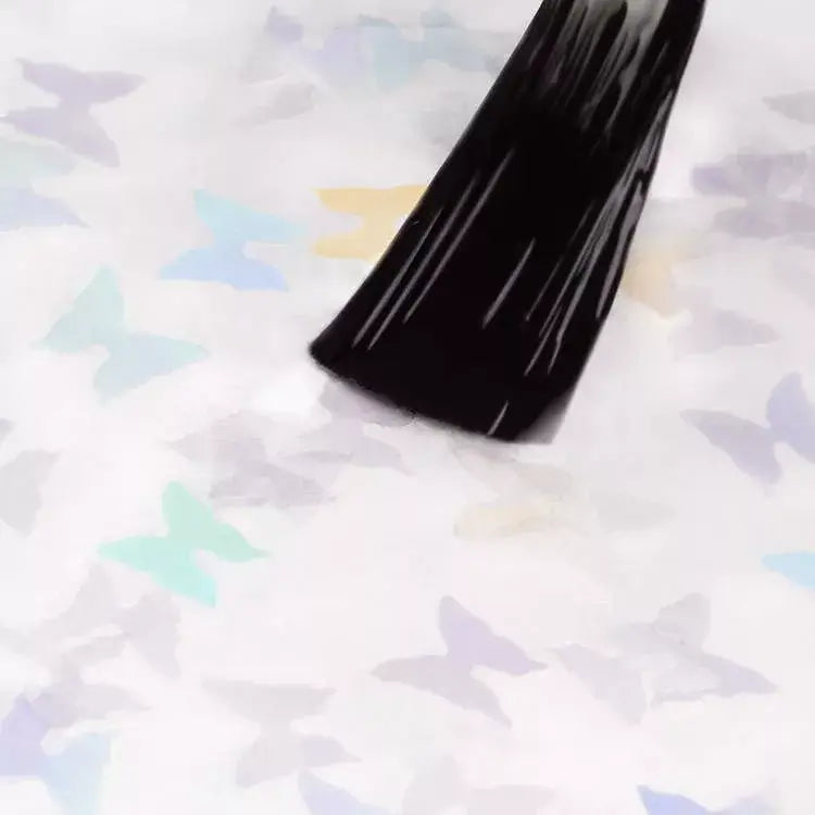 Applying Dancing Butterflies UV gel nail polish on a colorful butterfly design, ideal for spring manicures.