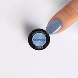 Polar Sparkle UV gel nail polish with blue Cat Eye effect and sparkling finish showcased on a manicured finger.