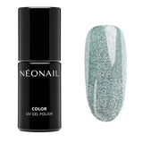 Snowstorm Glow UV gel polish bottle with shimmering green glitter swatch, perfect for stunning gel nails.