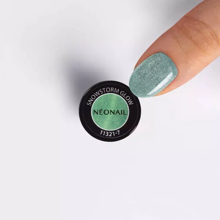 Snowstorm Glow UV gel polish with green shimmer and Cat Eye effect, showcased by a manicured nail.