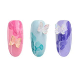 Nail art featuring 3D butterflies on colorful gel polish nails from the Blooming Dreams collection.