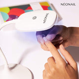 Flexi Tips LED Lamp curing UV gel nail polish for home nail kit with stylish fingers.