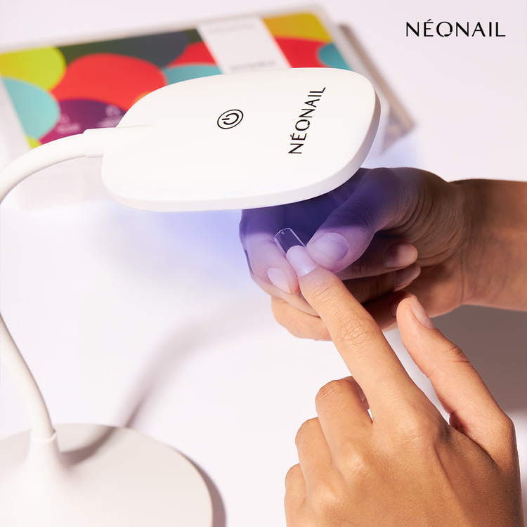 Flexi Tips LED Lamp curing UV gel nail polish for home nail kit with stylish fingers.