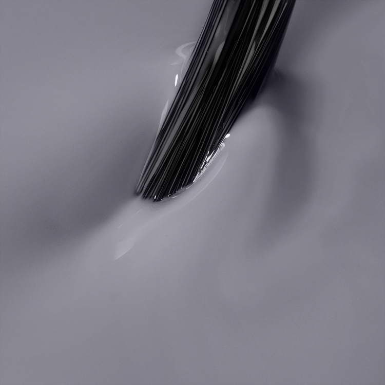 Brush applying Independent Spirits graphite grey UV gel polish for gel nails.