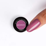 Ticket To Anywhere UV/LED gel polish in vibrant pink shade, displayed beside manicured nail.