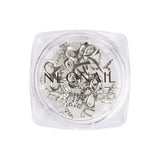 3D silver decoration bows in a clear container, perfect for enhancing gel nail art and home manicure kits.
