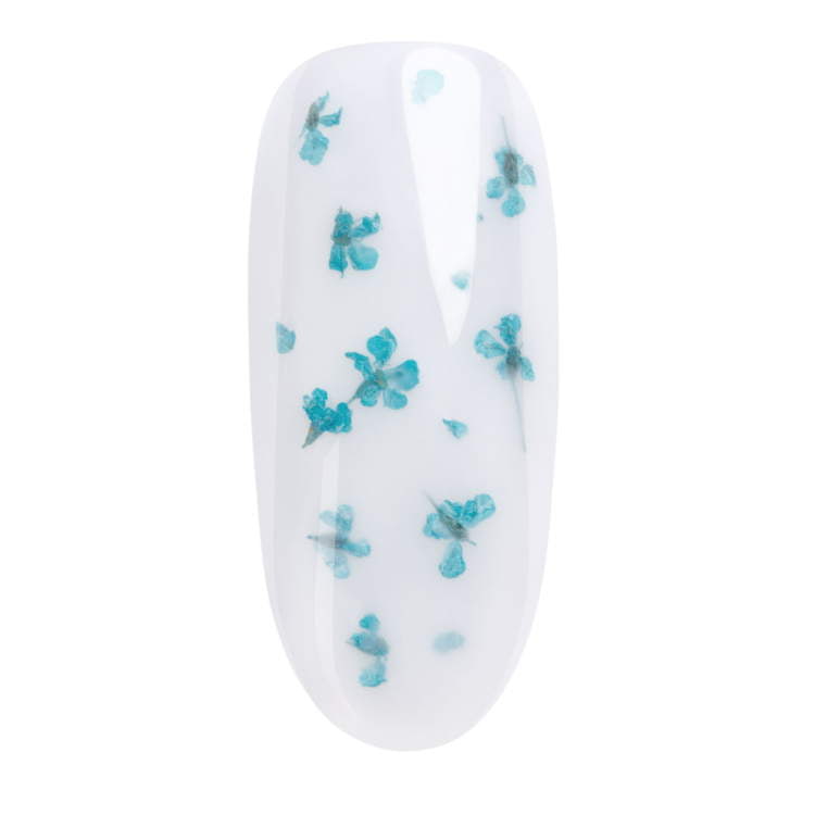 Turquoise dried flowers on a nail design for easy UV gel nail art, enhancing home manicure kits with floral accents.