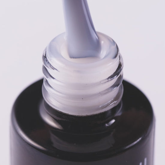 Close-up of Top Milky Effect Creamy UV gel polish, highlighting its smooth consistency and subtle color for elegant nails.