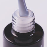 Close-up of Top Milky Effect Creamy UV gel polish, highlighting its smooth consistency and subtle color for elegant nails.