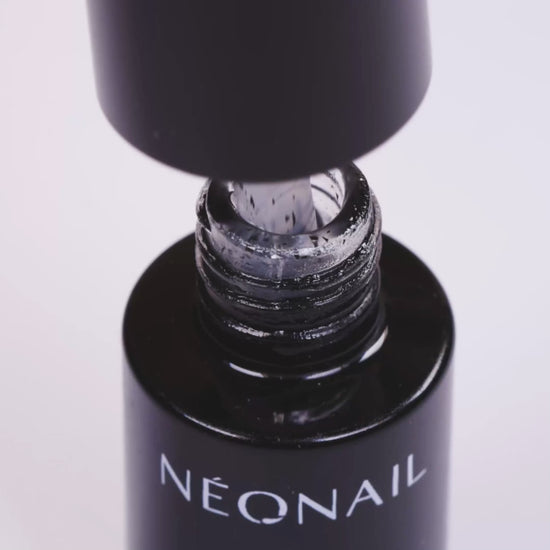 NÉONAIL Top Crush UV/LED gel polish bottle showcasing matte finish and black particles, perfect for stylish gel nails.
